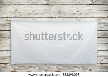 Copy space for text on disastrously white vinyl banner on wood background .Clipping path