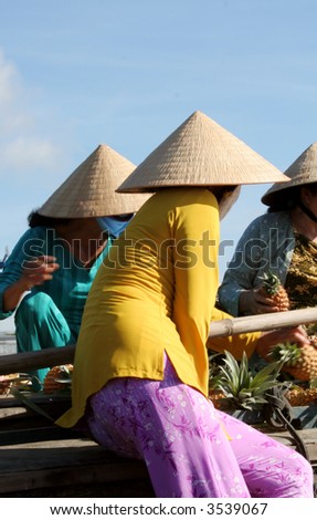 Vietnamese Vendors at the Floating Market in Mekong River Delta, Vietnam