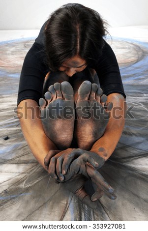 close-up of the feet and hands of the artist