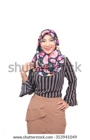 Pretty young Asian Muslim woman look polite in action.