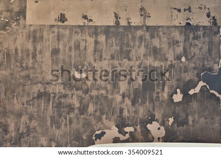 brown texture of shabby paint and plaster cracks
