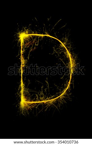 English alphabet from sparkler on black background,Alphabet big letter