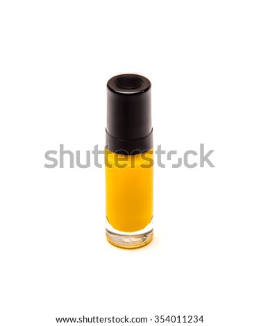 yellow nail polish bottle isolated on white background