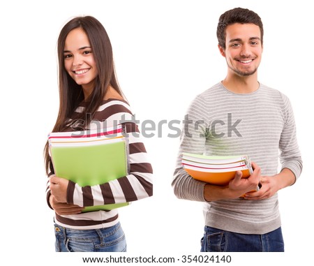 Young happy students posing over white background Royalty-Free Stock Photo #354024140