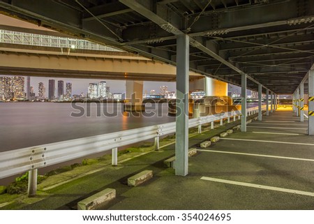 Empty outdoor car parking space at night time