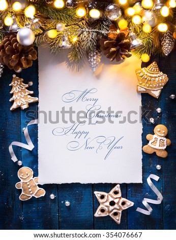 Christmas background with fir branches and silver balls with holidays light