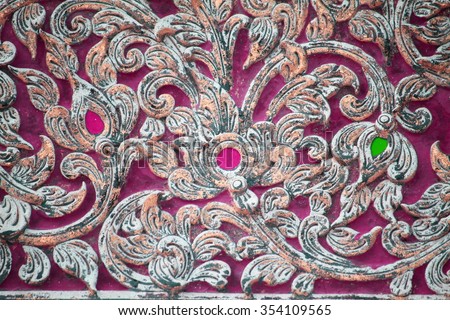 Pattern of carved on wood background on the wall of temple Thailand