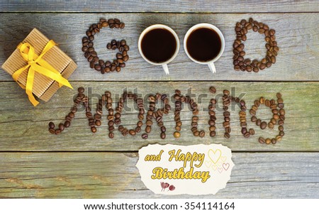 good morning concept - coffee beans, Cup of black coffee. Happy Birthday message lovely message and present (gift), space for text. toned image, sunlight effect.