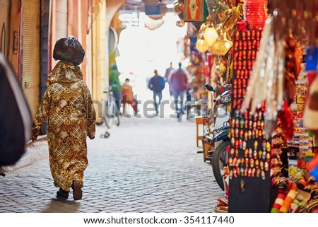 Women on Moroccan market (souk) in Marrakech, Morocco Royalty-Free Stock Photo #354117440