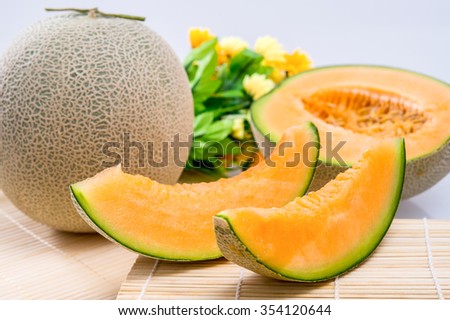 cantaloupe melon on the wooden table Royalty-Free Stock Photo #354120644