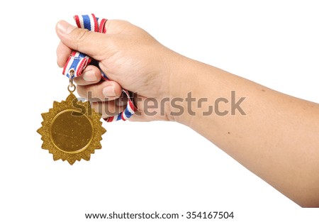 Golden medal in hand isolated on white background.