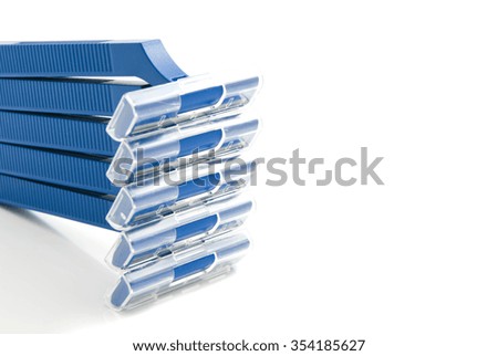 five blue razors on white background closeup