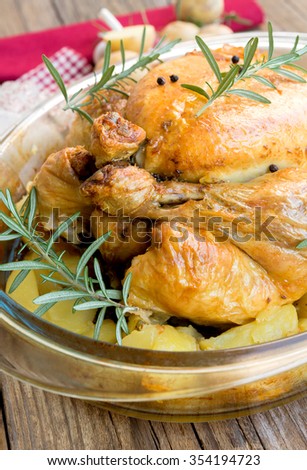 Roast chicken stuffed with potatoes and aromas