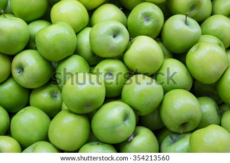 Green Apple Background, shallow depth of field. Royalty-Free Stock Photo #354213560