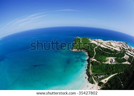 Golf resort on a tropical peninsula cliff