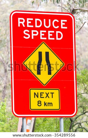 Reduce speed road sign.