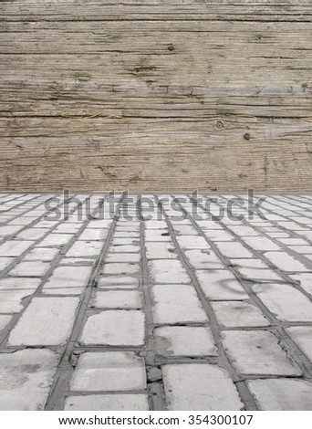 brick floor with a wooden wall