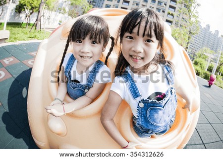 Two girls play in park
