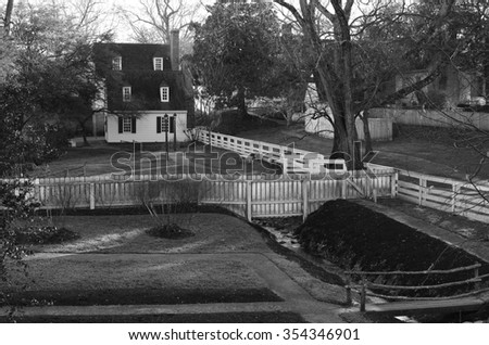 Beautiful black and white picture of  a house with a creek passing by in Williamsburg colonial town in Virginia, United States of America