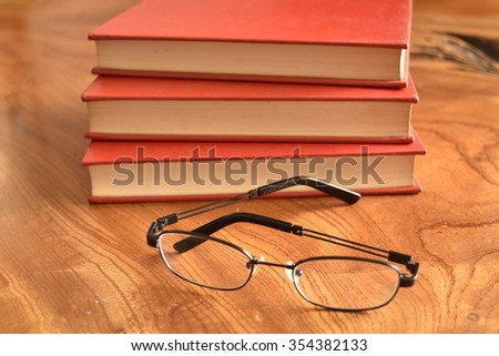 Book with a red cover with glass