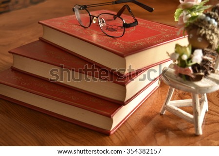 Book with a red cover with glass