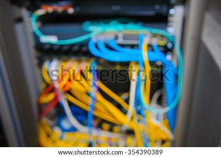 Abstract blurred of busy wire ethernet cables and network switch