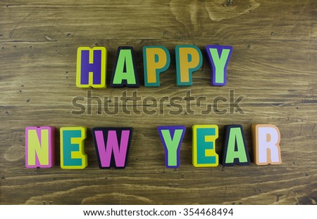 Word "HAPPY NEW YEAR" on old vintage wood plates
