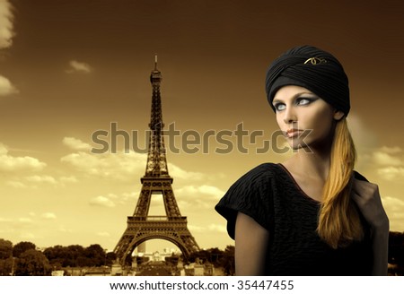 beautiful girl portrait with tour eiffel on the background