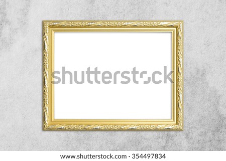 old antique gold frame on cement wall background