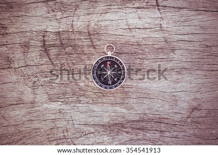 Compass on the wood. Vintage style.