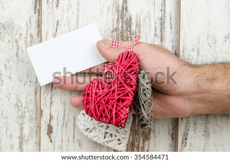 Tasks and heart are held in the hand