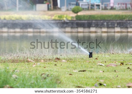 Sprinkler in park ,Garden irrigation system watering lawn