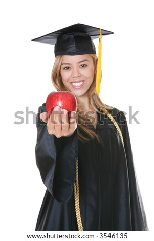 A beautiful woman graduate with an apple over white