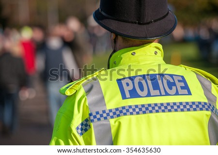 British police officer uniform with high visable yellow jacket