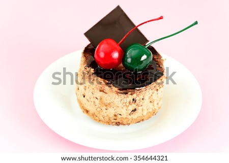 Cake with Cherries and Chocolate, Cupcake on Wood Background. Studio Photo.