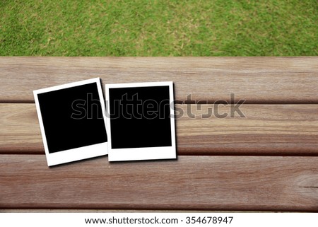 Retro photo frame  on wood background