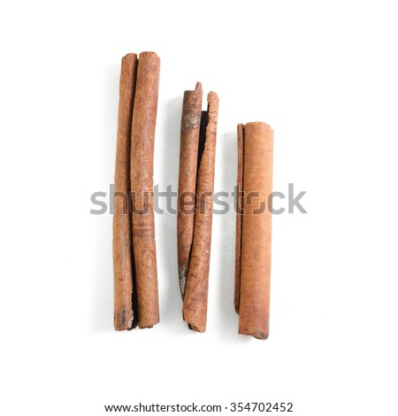 Beautiful Cinnamon sticks isolated on white background Royalty-Free Stock Photo #354702452