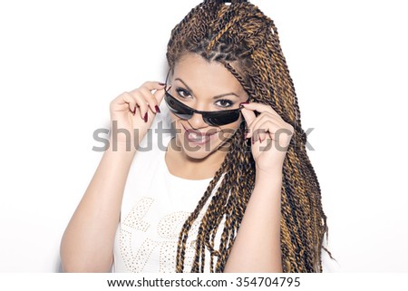 Smiling woman looking over her sunglasses