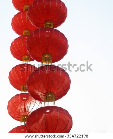 cascading chinese red lanterns against white background