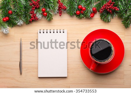 Boxes with gifts on a wooden background. White notepad. Happy new year. Space for text. Colorful Concept. New Year background. Christmas. Xmas. Noel.