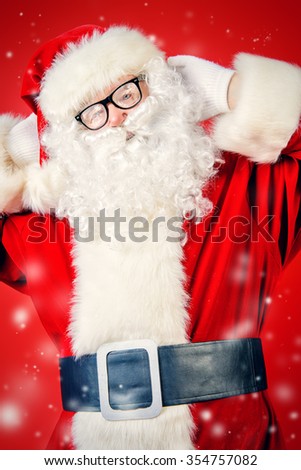 Santa Claus in frozen spectacles over Christmas red background. 