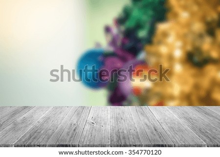 Wood terrace and Blurred of Christmas tree decoration for merry christmas Xmas and happy new year , process in vintage style
