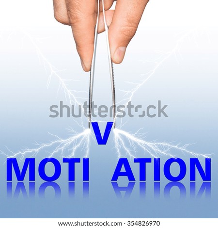 hand with  forceps and  word motivation . business concept