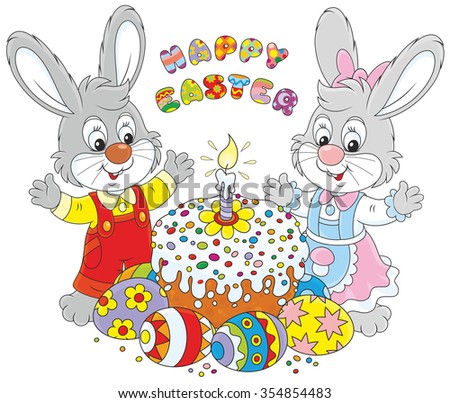 Happy little rabbits with a decorated Easter cake and colorfully painted eggs
