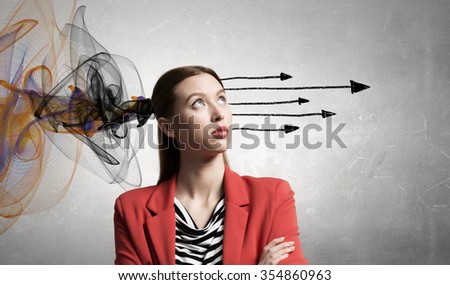 Pretty young woman making decision with arrows coming out of her head