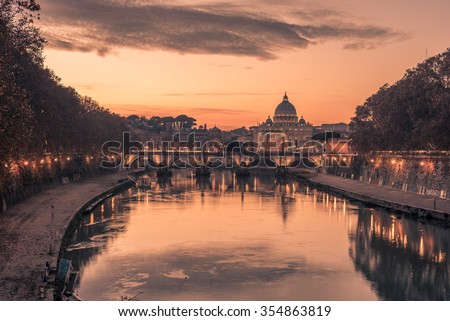 Rome, Italy: spectacular St. Peter's Basilica, Saint Angelo Bridge and Tiber River in the amazing, astonishing sunset of Italian winter. Beautiful, wonderful representative picture of the Forever City