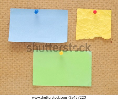 color empty notes on wooden background