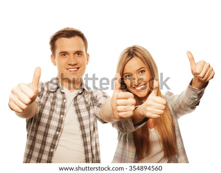 people, friendship, love and leisure concept - lovely couple with thumbs-up gesture isolated on white
