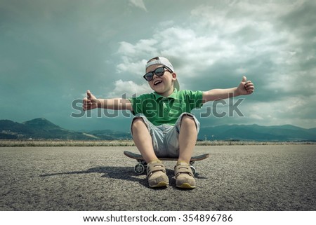 Child with skateboard under sunlight.