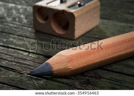 Pencil  and  sharpener on wooden background
